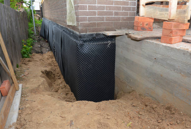 SJ Waterproofing Pros technician performing targeted Waterproofing assessment in Osseo, WI